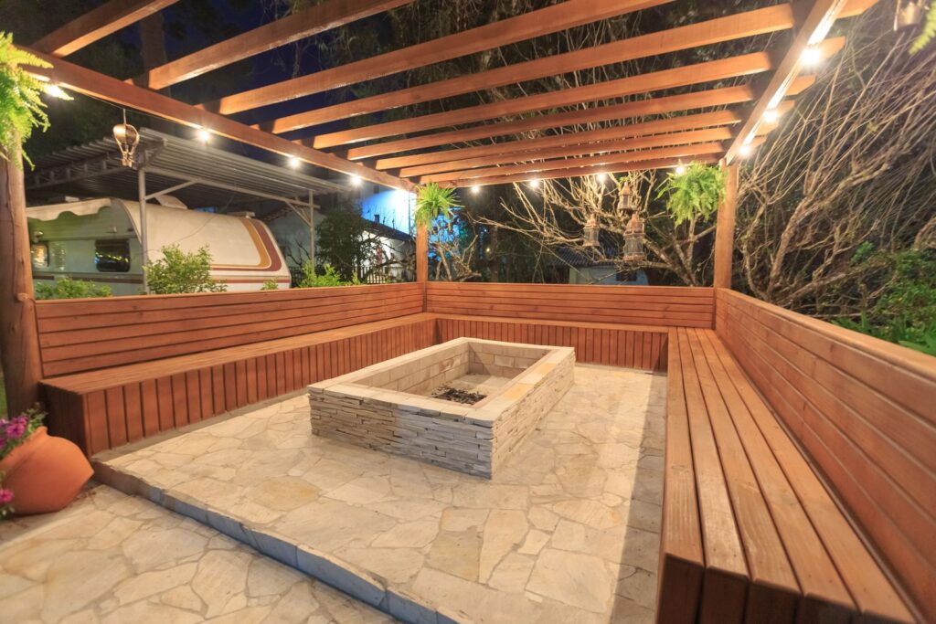 Backyard fire pit surrounded by wooden benches