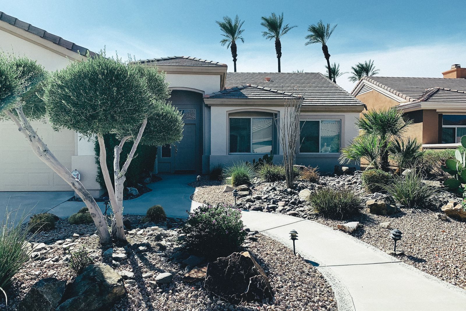 Family home with low-maintenance rock landscaping