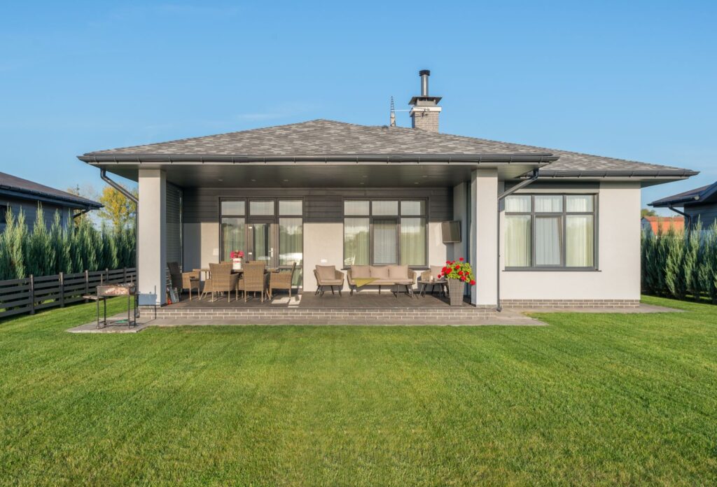 Green lawn in the backyard of a new house