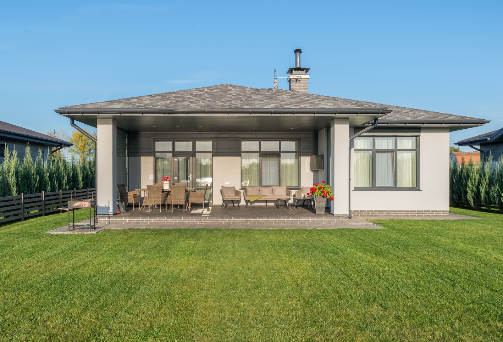 Green lawn in the backyard of a new house